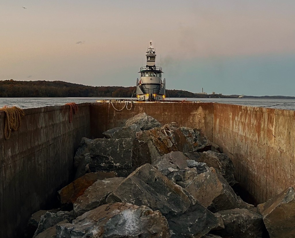 Barge loaded with aggregate pushed by Maddie K tugboat