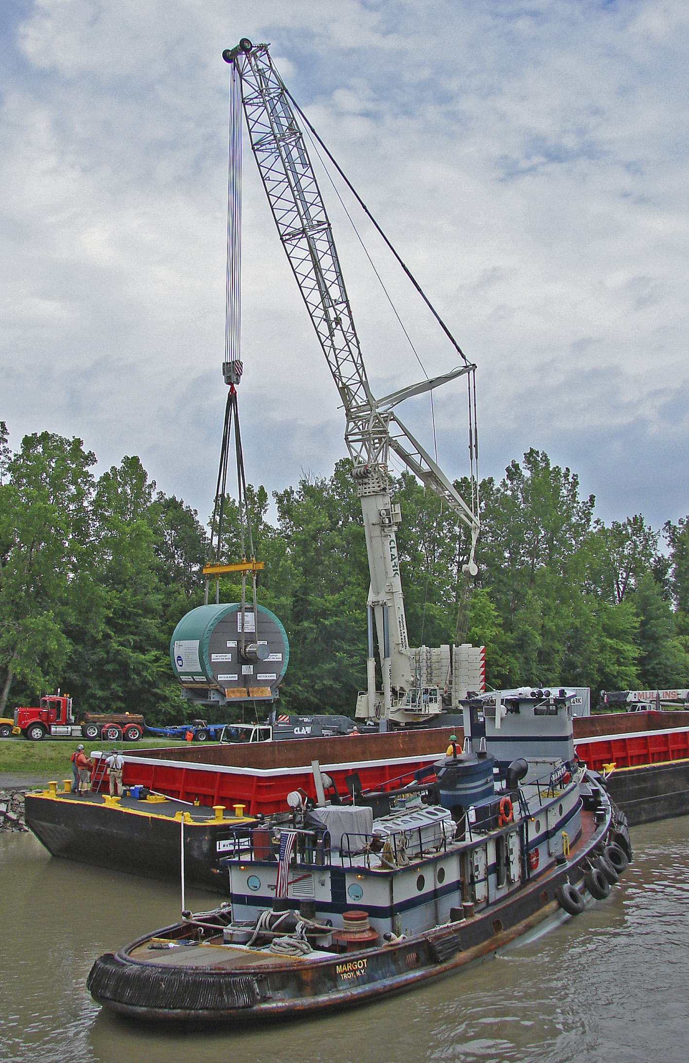 Tug with Metso-Irving tissue mill project cargo on a canal barge
